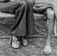 David Goldblatt, Couple at The Wilds. Johannesburg., 1975. Vintage gelatin silver hand print, 14-1/4" × 14-1/4" (36.2 cm × 36.2 cm), image unique. © The David Goldblatt Legacy Trust.