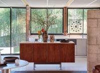 At The Luss House: Blum & Poe, Mendes Wood DM and Object & Thing. The Gerald Luss House, Ossining, New York. Photo by Michael Biondo. Works pictured [foreground left to right]: Green River Project LLC, Aluminum Round Table (2021); micaceous clay vessels by Johnny Ortiz (2021); glass vessels by Ritsue Mishima (2007-2012); [kitchen island left to right]: Ritsue Mishima, Bozzolo Di Seta (2012); Ritsue Mishima, Anima (2012); a black stoneware vase and a porcelain vase by Frances Palmer (2021); micaceous clay vessels by Johnny Ortiz (2021); [background]: Gerald Luss, Infinity Timepiece (2020.)
              