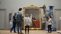 The hanging of Jacques Louis David's Portrait of Antoine-Laurent and Marie Anne Lavoisier at The Met Museum, New York. Credit: Eddie Knox © Oxford Films, 2021. Image courtesy PBS.