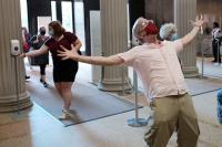 Visitors celebrate as The Met reopens in August 2020 after the closure due to Covid 19. Credit: Taylor Hill © Taylor Hill, 2020. Image courtesy PBS.