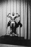 Diane Arbus, <em>Kenneth Hall, the new Mr. New York City, at a physique contest, N.Y.C.</em>, 1959. Gelatin silver print. © The Estate of Diane Arbus