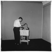 Diane Arbus, <em>Photographer posing communion boy, N.Y.C.</em>, 1968. Gelatin silver print. © The Estate of Diane Arbus