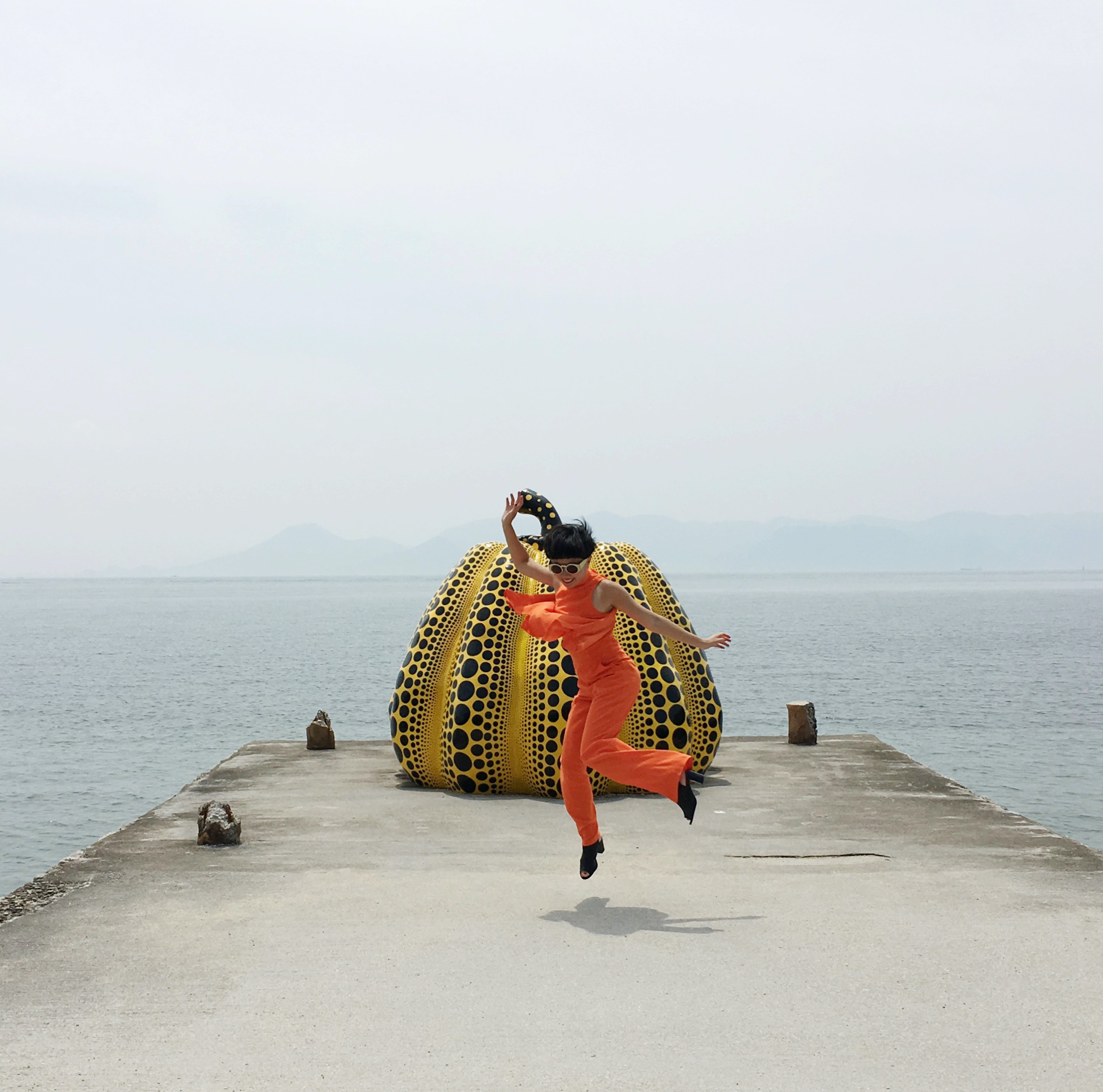 Fei with Yayoi Kusama’s Pumpkin on Naoshima Island, Japan, 2017