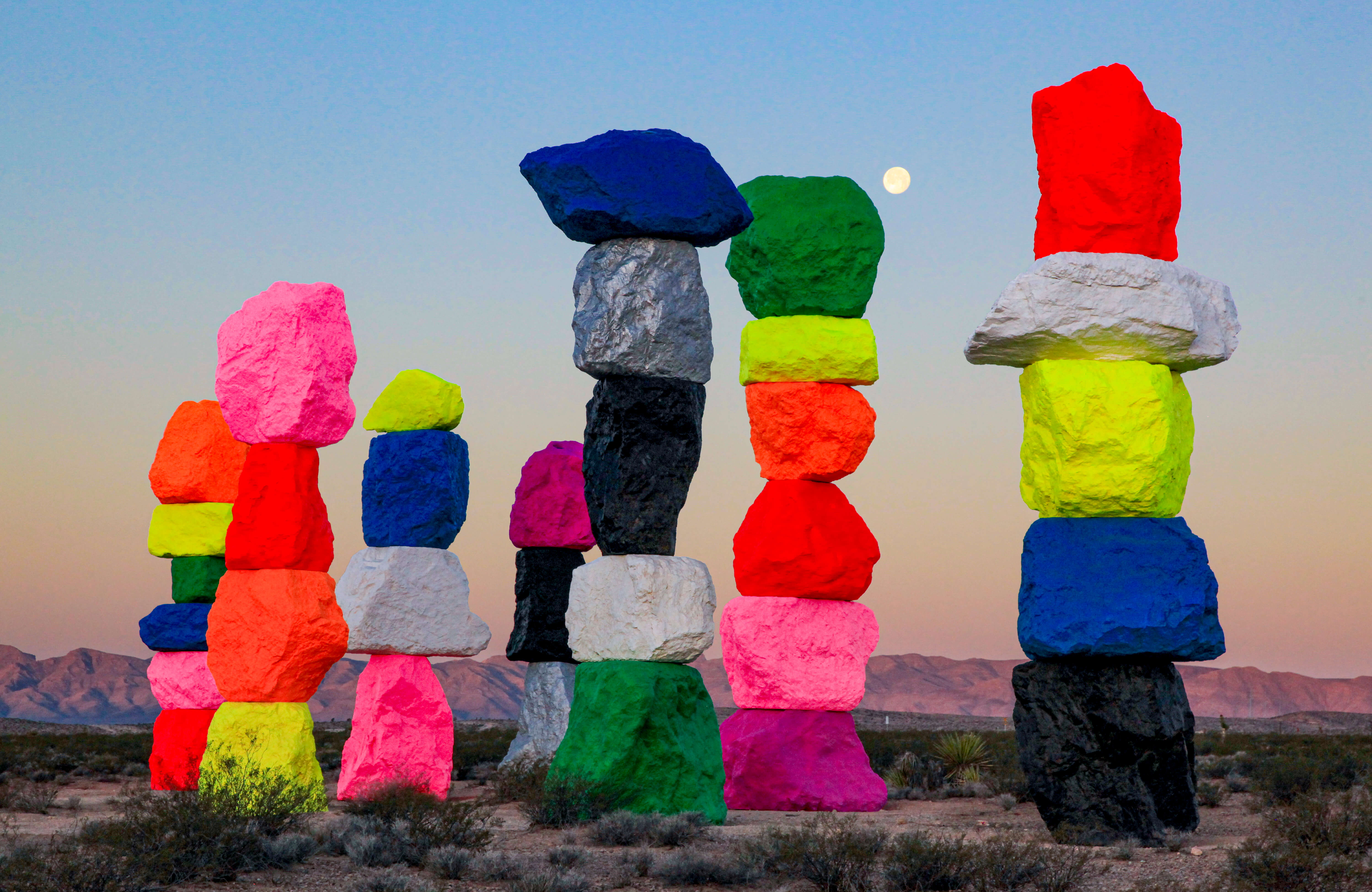 Gianfranco Gorgoni, _Ugo Rondinone’s Seven Magic Mountains, near Jean Dry Lake, Nevada_, 2016. Chromogenic print. Photograph from the Collection of the Nevada Museum of Art, The Altered Landscape, Carol Franc Buck Collection, with additional support from the Estate of Nancy L. Peppin; Photograph © Estate of Gianfranco Gorgoni; Artwork co - produced and presented by the Nevada Museum of Art and Art Production Fund; Artwork © Ugo Rondinone.