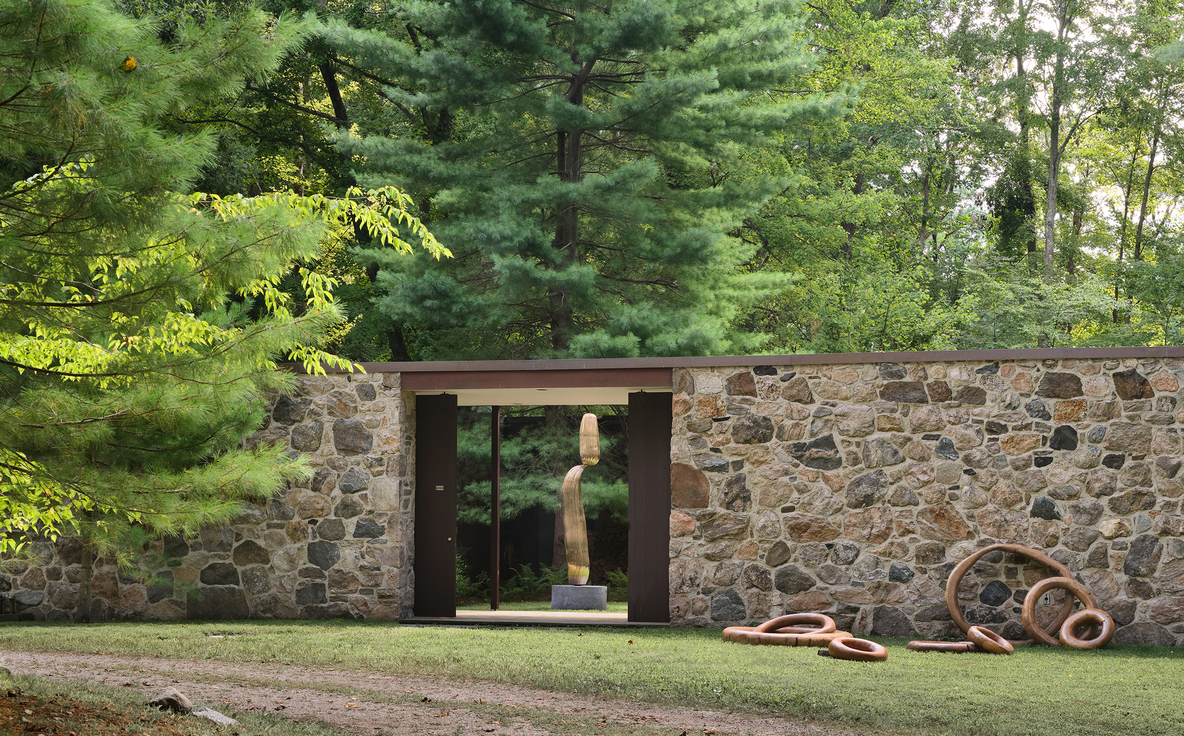 At The Noyes House: Blum & Poe, Mendes Wood DM and Object & Thing. The Noyes House, New Canaan, Connecticut. Photo by Michael Biondo. Works pictured [left to right]: Alma Allen, Not Yet Titled (2020); Hugo França, Rings (2007).